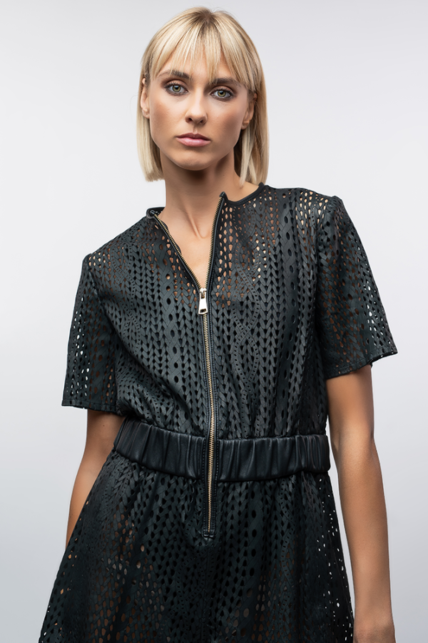 A jumpsuit made from perforated leather